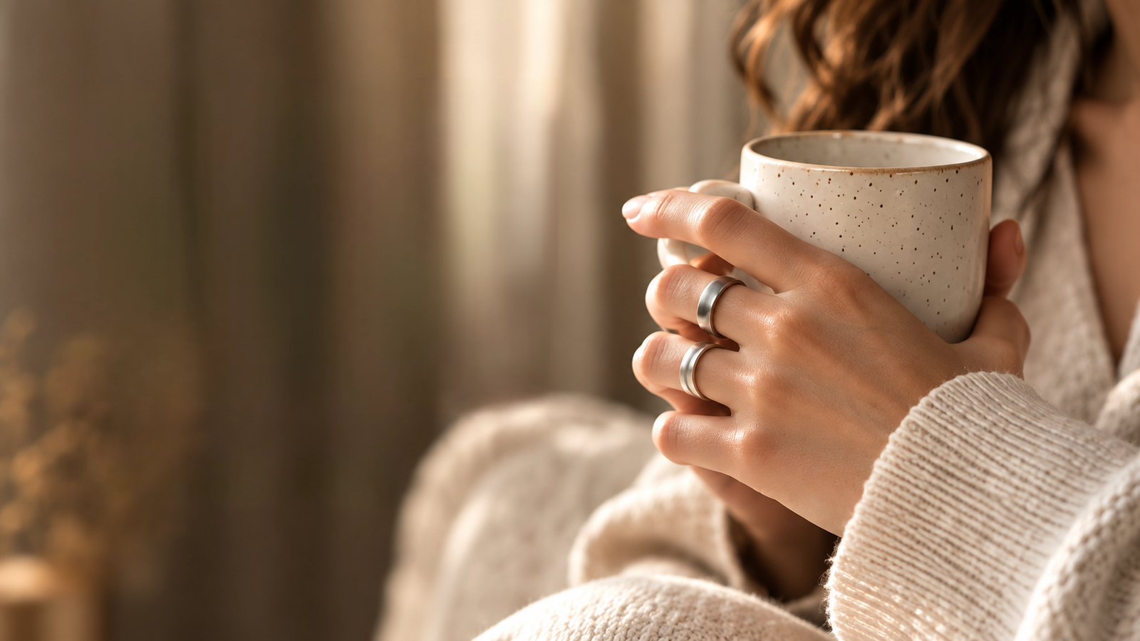 Woman holding a warm cup in gentle light